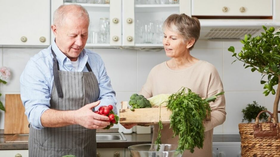 Senior Citizens working in a kitchen.