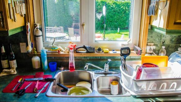 Sink full of dirty dishes.